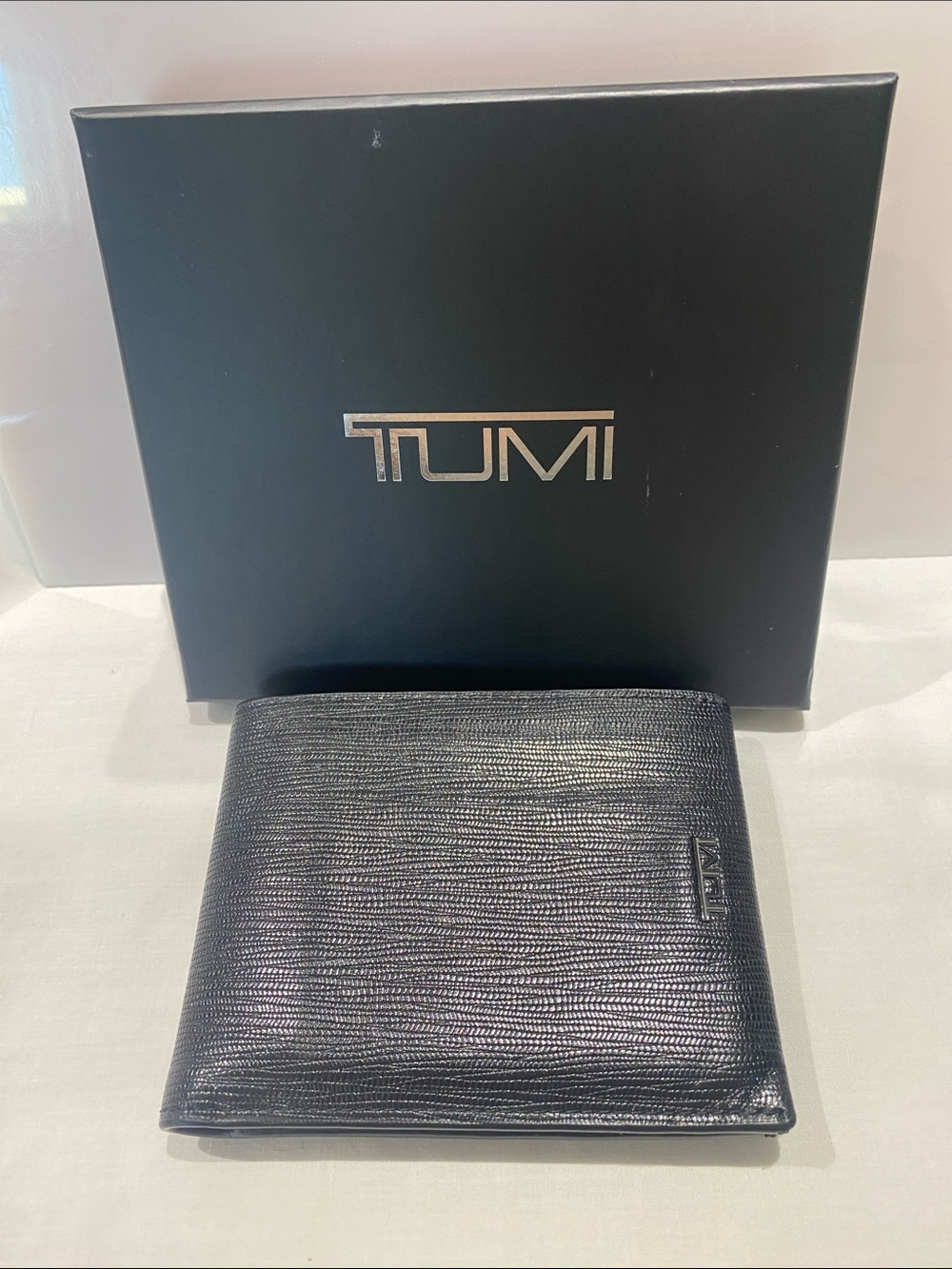 Tumi Black Textured Leather Bi-Fold Wallet with Logo